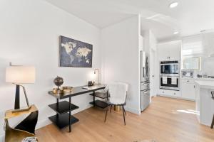 a white apartment with a desk and a kitchen at Modern Upscale Townhouse in Park City in Park City