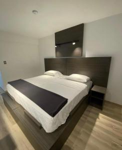 Ένα ή περισσότερα κρεβάτια σε δωμάτιο στο Hotel Princesa Plaza