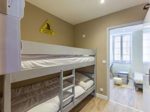 a bunk room with two bunk beds in it at Appartement Cauterets, 2 pièces, 4 personnes - FR-1-401-252 in Cauterets