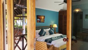 Postel nebo postele na pokoji v ubytování Fihalhohi Maldives