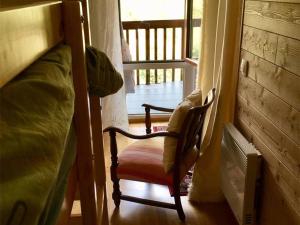 a chair in a room with a bunk bed at Appartement Les Angles, 2 pièces, 4 personnes - FR-1-295-149 in Les Angles