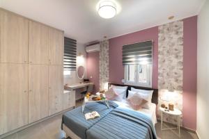 A bed or beds in a room at Chania Design Suites