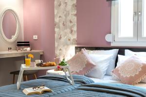 A bed or beds in a room at Chania Design Suites