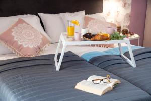 A bed or beds in a room at Chania Design Suites