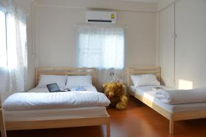 Postel nebo postele na pokoji v ubytování PanPan Hostel