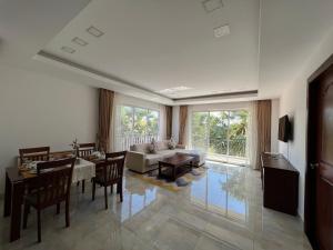 a living room with a couch and a table at SSK Apartment in Siem Reap