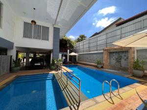 a swimming pool in the backyard of a house at SSK Apartment in Siem Reap