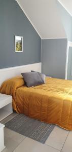 En eller flere senge i et værelse på Vinea del Selvatico cascina agricola