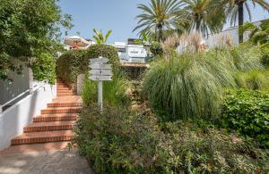 A garden outside Puente Romano Hotel Apartment Marbella