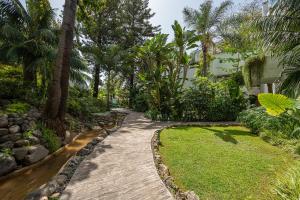 A garden outside Puente Romano Hotel Apartment Marbella