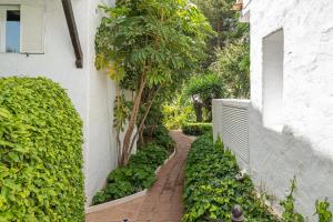 A garden outside Puente Romano Hotel Apartment Marbella