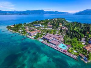 an aerial view of a resort on the water at Prestige Apartment in Sirmione
