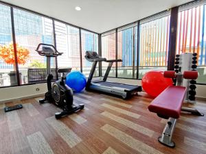 a gym with several exercise equipment in a building at ESSY Hotel KL Sentral in Kuala Lumpur