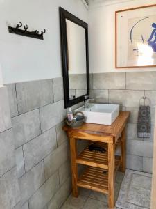 a bathroom with a sink and a mirror at @19 Queenstreet in Calitzdorp