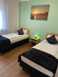 Postel nebo postele na pokoji v ubytování Residenz Hotel Wuppertal