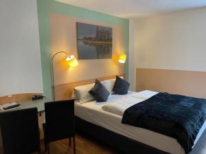 Postel nebo postele na pokoji v ubytování Residenz Hotel Wuppertal
