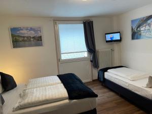 Postel nebo postele na pokoji v ubytování Residenz Hotel Wuppertal