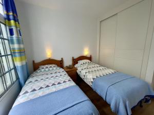 Posteľ alebo postele v izbe v ubytovaní Casa Lindi - Apartment near Puerto Rico beach