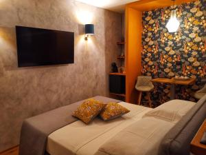 a bedroom with a bed with two pillows on it at Drì bed & breakfast in Rocca di Papa