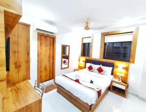 Postel nebo postele na pokoji v ubytování Gateway Suites