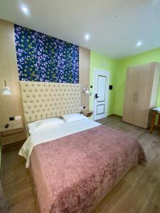 Postel nebo postele na pokoji v ubytování Pilo Lala Hotel