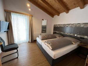 Rúm í herbergi á Haus Eder Steiner