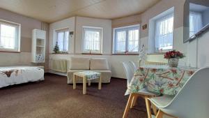 Postel nebo postele na pokoji v ubytování Apartmany Železná Ruda