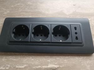 a black radio with four dials on a table at Stone House Montenegro in Danilovgrad