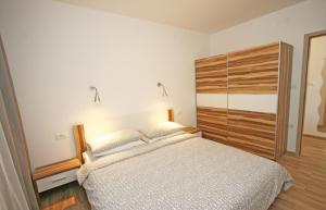 Postel nebo postele na pokoji v ubytování Jurman Apartment + 24 fotografií