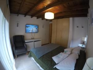 En eller flere senger på et rom på Apart El Mar