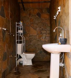 a bathroom with a sink and a toilet at The Red House in Amboseli