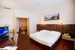 TV a/nebo společenská místnost v ubytování Hotel Minerva