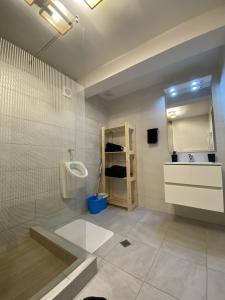 a bathroom with a shower and a sink at Alvi Apartment Poiana Brasov in Poiana Brasov