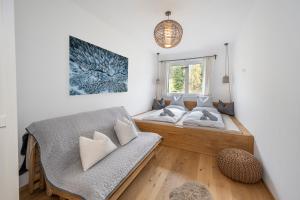Łóżko lub łóżka w pokoju w obiekcie JARA APARTMENT- Ramsau am Dachstein