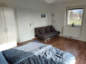 Posezení v ubytování Ferienwohnung ländlich und in Seenähe