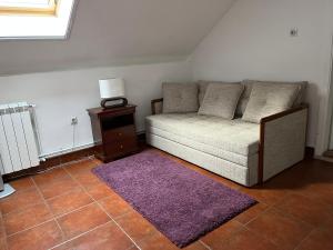 Ein Sitzbereich in der Unterkunft Apartment Dixy