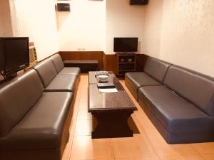 TV a/nebo společenská místnost v ubytování AMALFI718 HOTEL