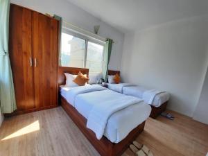 Postel nebo postele na pokoji v ubytování Eco Inn Guest House