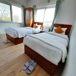 Postel nebo postele na pokoji v ubytování Eco Inn Guest House