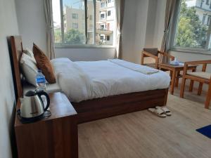 Postel nebo postele na pokoji v ubytování Eco Inn Guest House