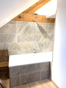 a bathroom with a shower with a sink at gérardmer plein centre idéal famille in Gérardmer