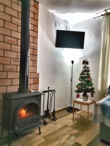 TV a/nebo společenská místnost v ubytování Casa Uly 2