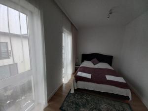 Łóżko lub łóżka w pokoju w obiekcie Apartament IGA
