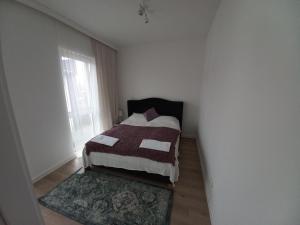 Łóżko lub łóżka w pokoju w obiekcie Apartament IGA