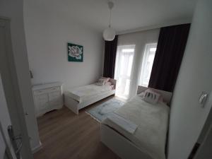 Łóżko lub łóżka w pokoju w obiekcie Apartament IGA