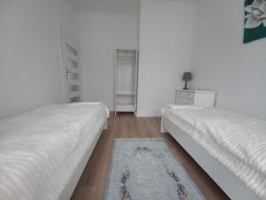 Łóżko lub łóżka w pokoju w obiekcie Apartament IGA