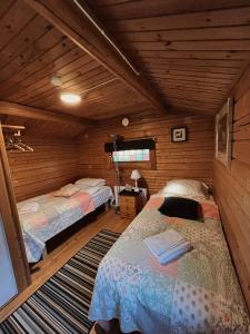 Postel nebo postele na pokoji v ubytování Råda Hotel