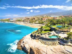 an aerial view of a beach and the ocean at Practical and cozy apartment in southern Arona in Arona