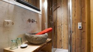 a carrot in a bowl on a counter in a bathroom at Haus Petra in Bach