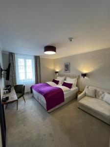 Łóżko lub łóżka w pokoju w obiekcie Hotel Radetzky